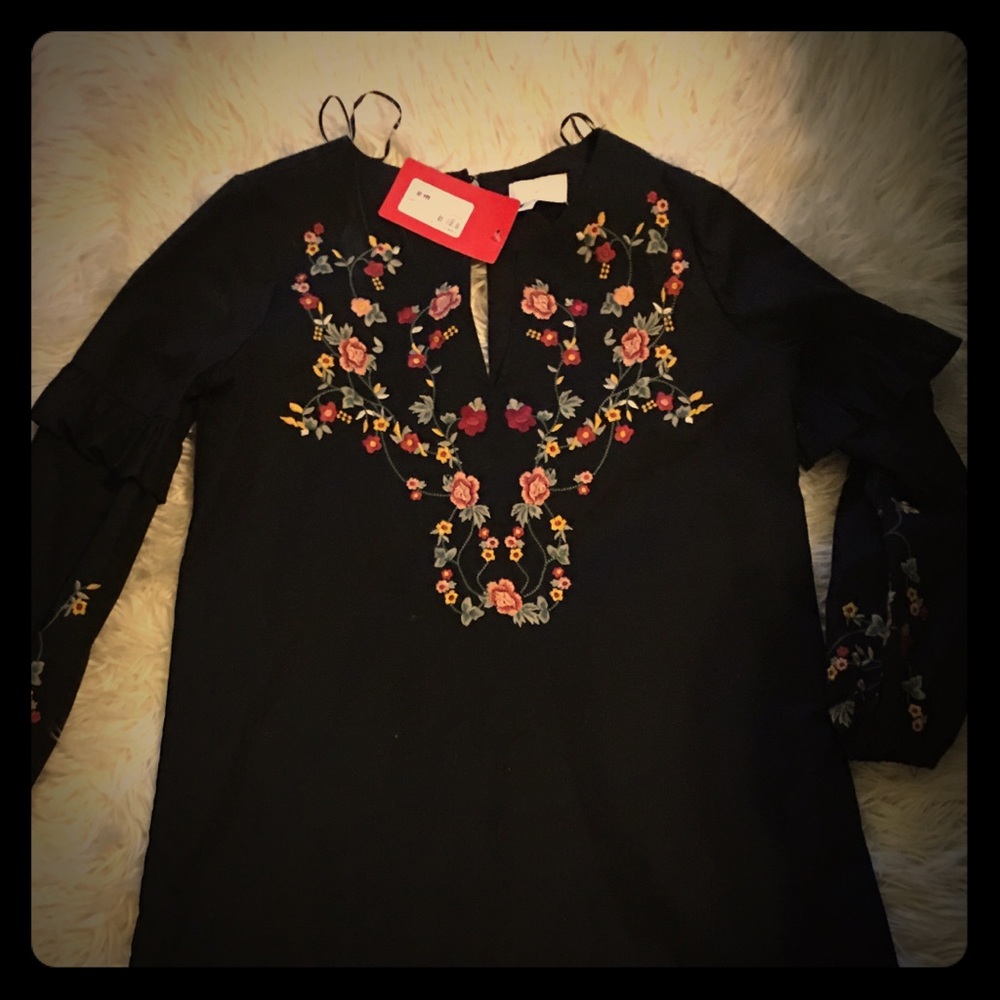 Flower embroidered dress.